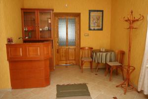 a kitchen with a table and a dining room at Élet es Energia Egészségjavító Szalon in Nagykőrös