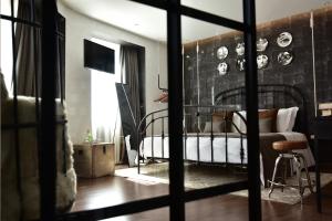Postel nebo postele na pokoji v ubytování Maxime Boutique Hotel Avenida da Liberdade