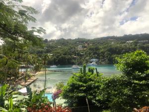a scenic view of a city with palm trees at Marigot Beach Club & Dive Resort in Marigot Bay
