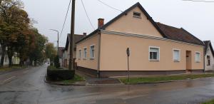 a house on the side of a street at Apartman SAN in Vukovar