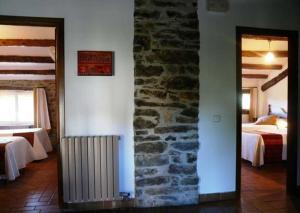 Giường trong phòng chung tại Casa Rural La Choca