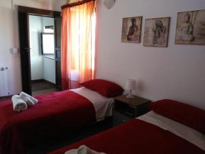 Postelja oz. postelje v sobi nastanitve B&B Piazza San Benedetto