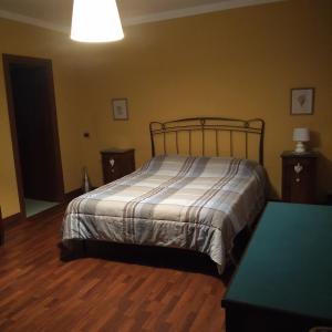 Postel nebo postele na pokoji v ubytování B&B Cascina Baraggione