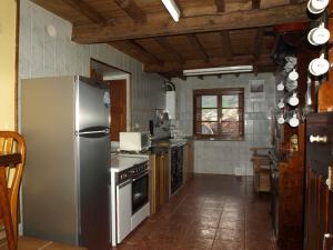 Kuchyň nebo kuchyňský kout v ubytování La Tanda