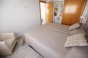 Posteľ alebo postele v izbe v ubytovaní Apartamento Montes de Oca
