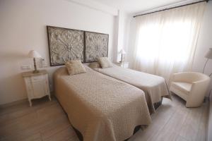 Posteľ alebo postele v izbe v ubytovaní Apartamento Montes de Oca