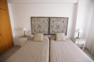 Posteľ alebo postele v izbe v ubytovaní Apartamento Montes de Oca