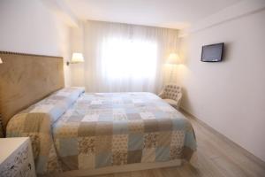 Posteľ alebo postele v izbe v ubytovaní Apartamento Montes de Oca