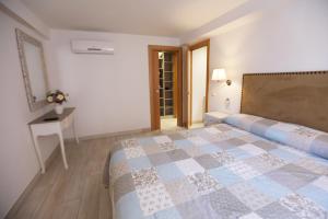 Posteľ alebo postele v izbe v ubytovaní Apartamento Montes de Oca