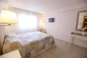 Posteľ alebo postele v izbe v ubytovaní Apartamento Montes de Oca