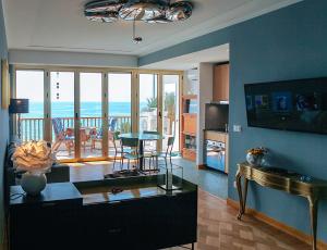 a living room with a view of the ocean at Promenade des Anglais - Studio suite seaside in Nice