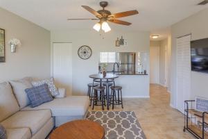 a living room with a couch and a ceiling fan at La Casa Del Mar 608 Star5Vacations in Dunedin