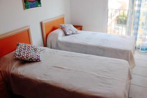 Postel nebo postele na pokoji v ubytování casa cerca playa con piscina comunitaria ref 252