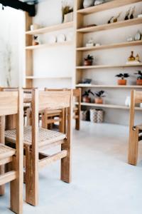 a room with wooden tables and chairs at Casa Pancha in Mexico City