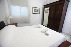 Posteľ alebo postele v izbe v ubytovaní Apartamento Mar de Korus