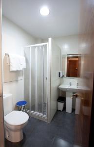 a bathroom with a shower and a toilet and a sink at Casa Rural Casole in Castalla