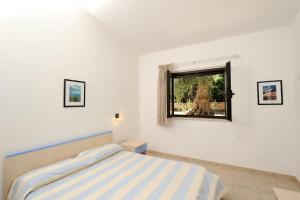 Posteľ alebo postele v izbe v ubytovaní Zagare Residence