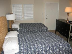 Llit o llits en una habitació de Gulfpoint Condos K1112