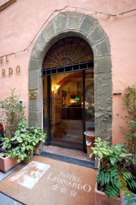 an entrance to a building with an arched doorway at Hotel Leonardo in Pisa