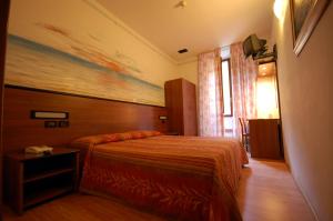 Postel nebo postele na pokoji v ubytování Hotel Leonardo + 18 fotografií