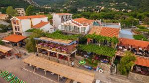 an overhead view of a town with a bench and buildings at Hotel Savojo in Petrovac na Moru
