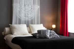 Postel nebo postele na pokoji v ubytování Hotel Matuchi