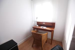 Televízia a/alebo spoločenská miestnosť v ubytovaní Apartamento Rialto