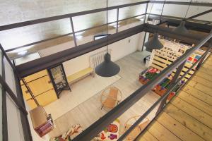 an overhead view of a store with pendant lights at Ostello dei Sassi - Matera Hostels in Matera