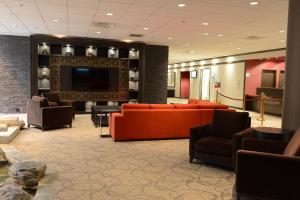 
a living room filled with furniture and a fire place at Holiday Inn Montreal Centre Ville Downtown, an IHG Hotel in Montreal
