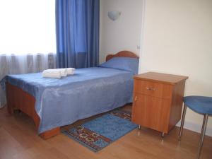 Кровать или кровати в номере Гостиница на Казанской