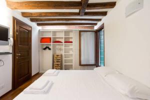 a bedroom with a large white bed in a room at Studio in San Marco square in Venice