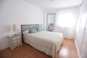 Posteľ alebo postele v izbe v ubytovaní Apartamento Rialto