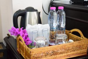 a basket with bottles and glasses on a table at Wan Wan Place in Ao Nang Beach