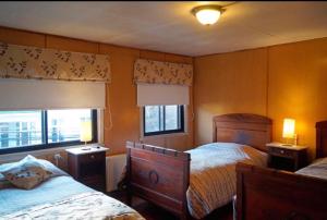 Кровать или кровати в номере Hostal del Muelle