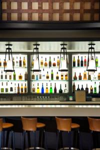 a bar with several bottles of alcohol on the wall at Walnut Beach Resort in Osoyoos