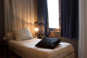 Postel nebo postele na pokoji v ubytování Hotel Matuchi