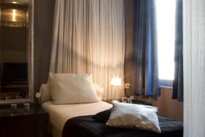 Postel nebo postele na pokoji v ubytování Hotel Matuchi