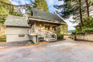 a house with a garage and a driveway at Sunset Dunes in Florence