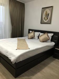 Una cama o camas en una habitación de Apartament Denissia