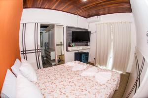Cama o camas de una habitación en Hotel Hostel Caçari