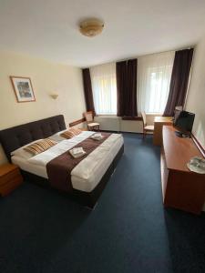 Posteľ alebo postele v izbe v ubytovaní Garni Hotel Tatramonti