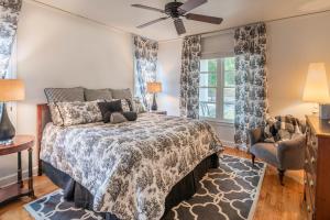 a bedroom with a bed and a ceiling fan at Linden - A Historic Bed and Breakfast in Natchez