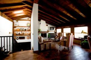 a living room with chairs and a fireplace at Casa Rural Torredano in Nalda
