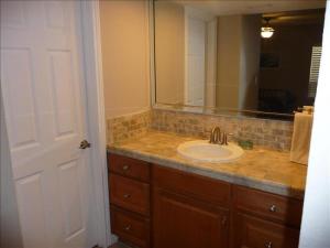 a bathroom with a sink and a mirror at Suntide I Condos W101 in South Padre Island