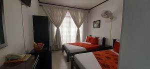 Voodi või voodid majutusasutuse Hotel Colonial toas