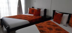 Voodi või voodid majutusasutuse Hotel Colonial toas