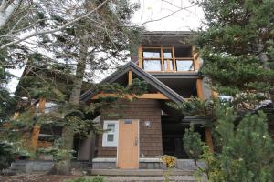 a house with a front door and trees at Glacier's Reach by Whistler Retreats in Whistler