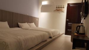 Postelja oz. postelje v sobi nastanitve Haichin&Haiting B&B