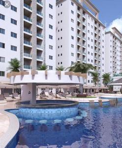 a swimming pool in front of a large building at Salinas Park Resort in Salinas