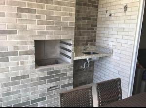 a bathroom with a sink and two chairs at Salinas Park Resort in Salinas